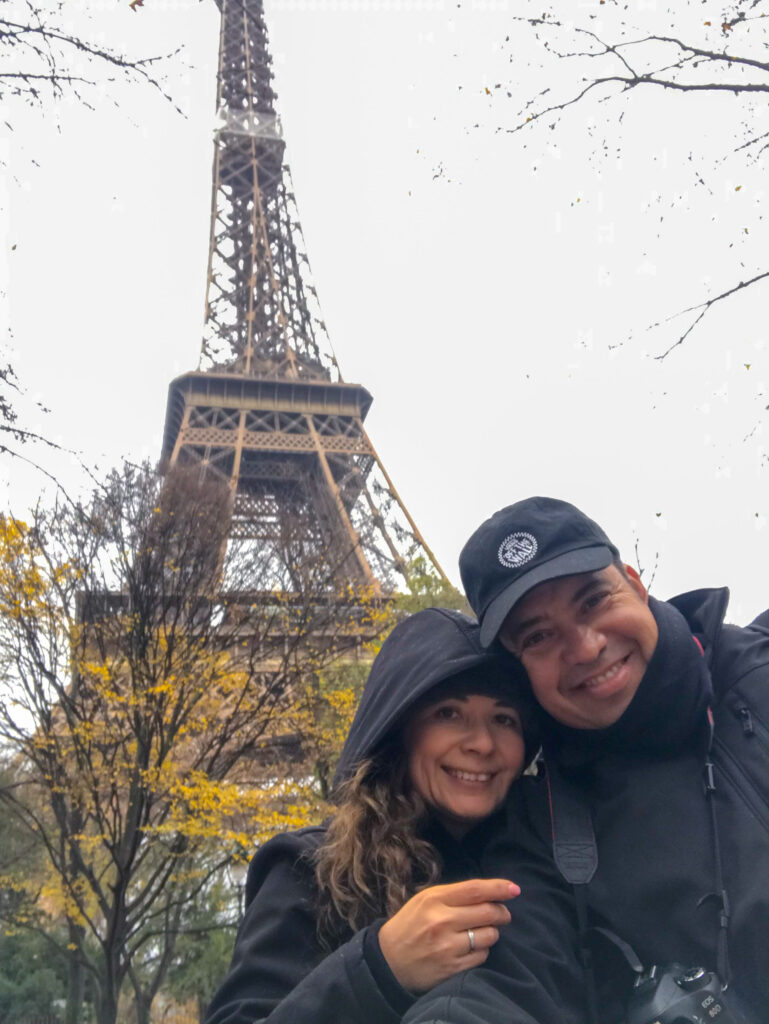 Happy couple selfie in front of the Eiffel Tower